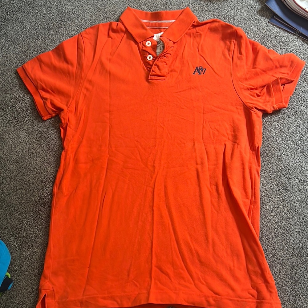 Aeropostale orange polo t-shirt with blue logo.